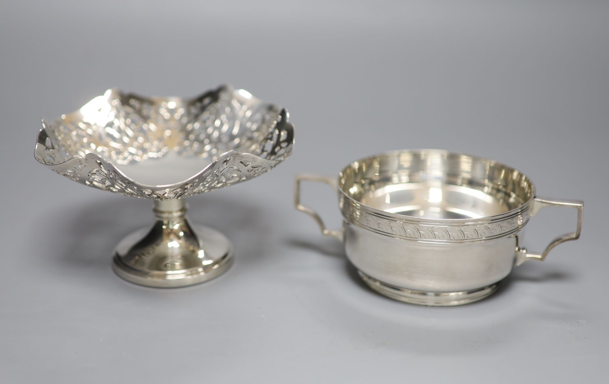 A pierced silver pedestal bon bon dish, Birmingham 1995, 4oz and a plated two-handled sugar bowl.